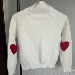 Never worn- heart elbow patches on pretty white high-neck sweater.